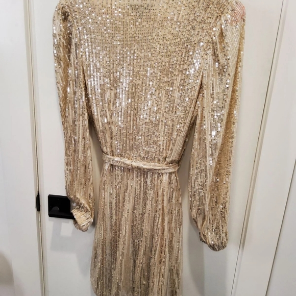 in the style Dresses & Skirts - Gold sequince wrap dress